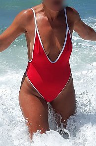 Swimsuit Milf Frolicking In The Ocean On Vacation