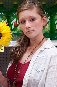 Pretty Freckles Girl Teasing In Public With A Sunflower